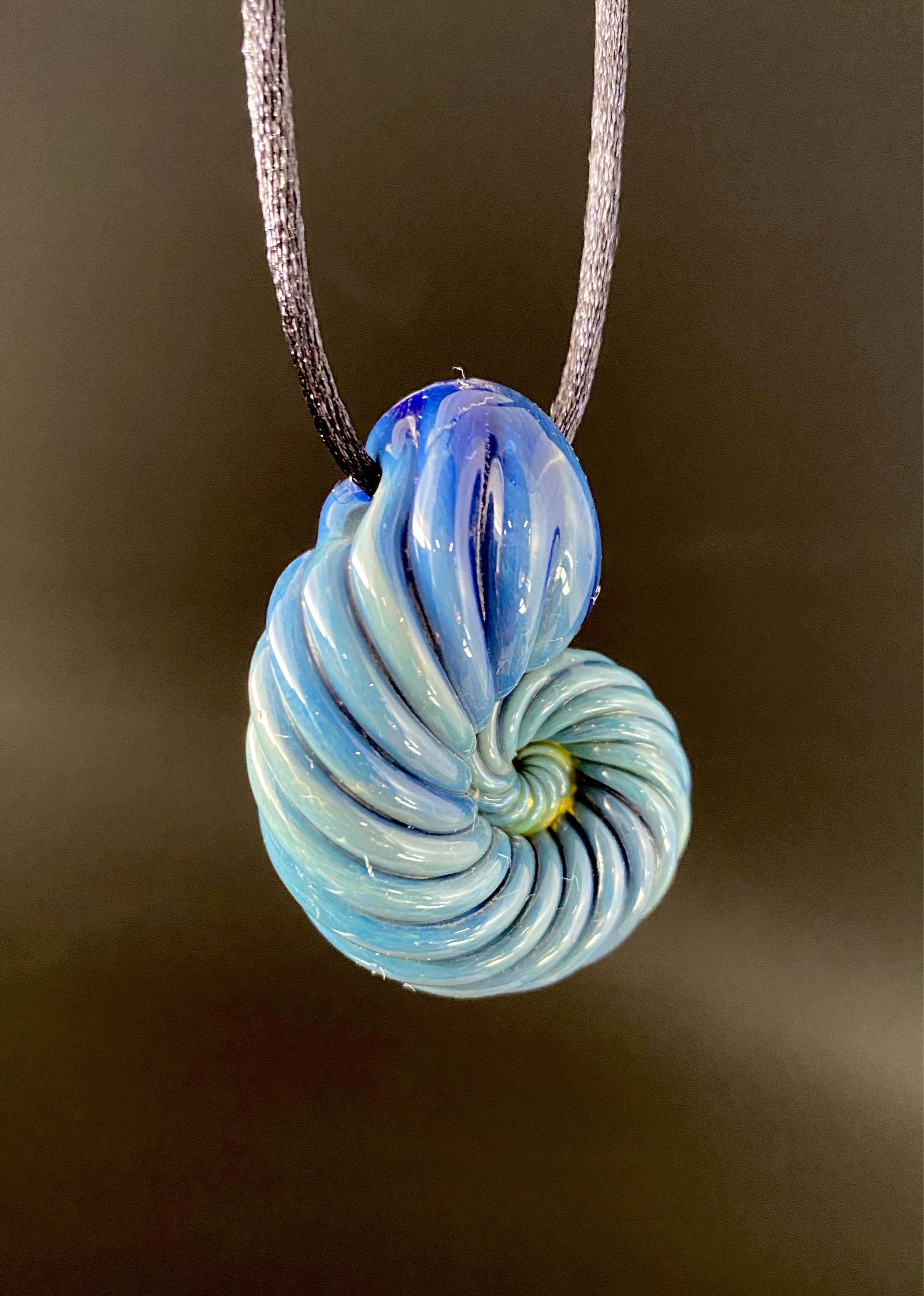 Ammonite pendant. (Deep sea)